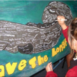 Students signing the banner